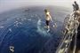 Navy Seaman Curtis Peterson jumps from the fantail of the USS Antietam during a swim call in the Indian Ocean, Feb. 3, 2016. Peterson is a logistics specialist. The Antietam is on patrol to support security and stability in the Indo-Asia-Pacific region. Navy photo by Petty Officer 3rd Class David Flewellyn