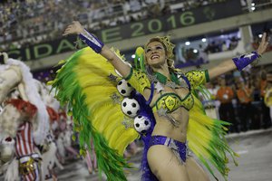 A performer from Grande Rio samba school parades during the Carnival celebrations at the Sambadrome in Rio de Janeiro, Brazil, Monday, Feb. 8, 2016.