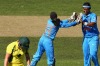 Long walk: Australia's Grace Harris trudges off after being dismissed by India's Shikha Pandey.