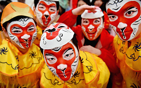 Members of the Chinese community of Glasgow dressed in traditional costumes celebrate The Year of The Monkey 