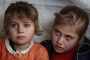 Eman al-Aqraa, 8, right, and her sister Fatima, 4, at a Syrian refugee camp in Lebanon.