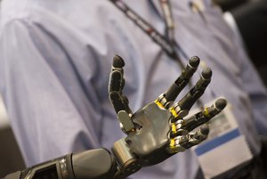 File - A robotic hand is seen while Secretary of Defense Ash Carter (not pictured) is briefed on the robotic limb exhibit at the Defense Advanced Research Projects Agency “Wait, What?