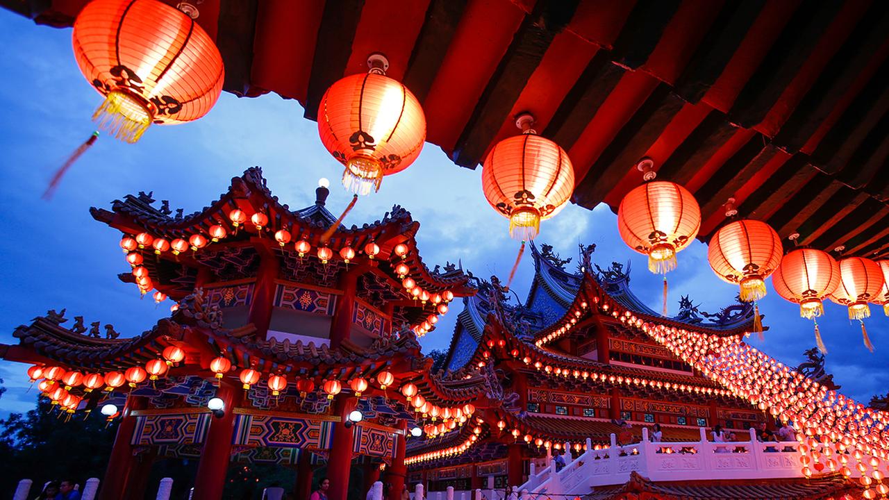 Traditional Chinese lanterns illuminates the evening skies on the eve of Lunar New Year in Kuala Lumpur, Malaysia, Sunday, Feb. 7, 2016. 