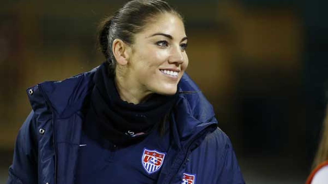 United States goalkeeper Hope Solo stands on the sidelines before a CONCACAF soccer match against Haiti, at RFK Stadium, Monday, Oct. 20, 2014, in Washington.