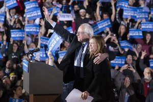 Democratic presidential candidate Sen. Bernie Sanders, I-Vt., center left, waves to the crowd with his wife Jane after speaking during a primary night watch party at Concord High School, Tuesday, Feb. 9, 2016, in Concord, N.H.