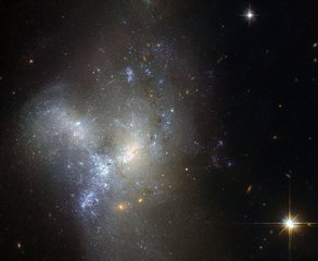 File - This image, taken by the NASA/ESA Hubble Space Telescope, shows a peculiar galaxy known as NGC 1487, lying about 30 million light-years away in the southern constellation of Eridanus.