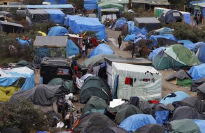 File - A view of  the migrant camp known as the new Jungle in Calais, northern France, Wednesday, Oct. 21, 2015. The mayor of the northern French city of Calais says troops may be needed to cope with the rising number of migrants camped in her city in hopes of reaching a better life in Britain