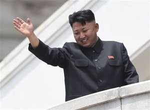 File - In this July 27, 2013 photo, North Korean leader Kim Jong Un waves to war veterans during a mass military parade celebrating the 60th anniversary of the Korean War armistice in Pyongyang, North Korea.