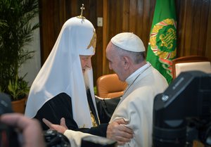 The head of the Russian Orthodox Church Patriarch Kirill, left, and Pope Francis greet each other as as they meet at the Jose Marti airport in Havana, Cuba, Friday, Feb. 12, 2016.