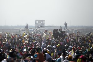 Pope Francis rides on a popemobile as he makes his way through pilgrims waiting for Mass in Ecatepec, Mexico, Sunday, Feb. 14, 2016.