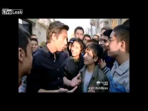 American reporter talking to Iranian school children about America