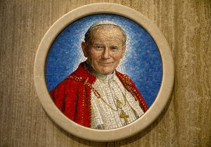 In this Sept. 1, 2015, photo, a tile mosaic of Pope John Paul II hangs in chapel at Basilica of the National Shrine of the Immaculate Conception in Washington, where he prayed during his visit here on Oct. 7. 1979