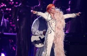 Lady Gaga performs a tribute to David Bowie at the 58th annual Grammy Awards on Monday, Feb. 15, 2016, in Los Angeles.