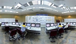 In this Monday, Nov. 30, 2009 photo released by the semi-official Iranian Students News Agency (ISNA), Iranian technicians, work with foreign colleagues at the Bushehr Nuclear Power Plant, just outside the southern port city of Bushehr, Iran.