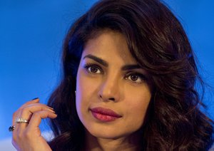 Indian Bollywood actor and UNICEF Goodwill Ambassador, Priyanka Chopra gestures during the launch of a media campaign of Weekly Iron and Folic Acid Supplement (WIFS) Program in New Delhi, India, Wednesday, Dec. 23, 2015.