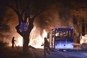 Firefighters work at a scene of fire from an explosion in Ankara, Wednesday, Feb. 17, 2016.