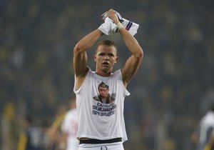 Locomotiv Moscow's Dmitri Tarasov features an inner shirt with a picture of Russian President Vladimir Putin and the slogan "The most polite President", following a Europa League first leg round of 32, soccer match against Fenerbahce in Istanbul, Tuesday, Feb. 16, 2016.