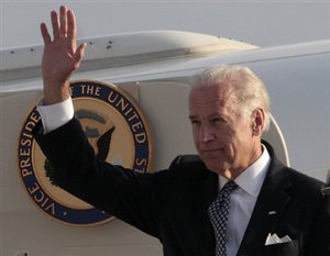 U.S. Vice President Joe Biden waves as he arrives in Georgia's capital Tbilisi, Wednesday, July 22, 2009