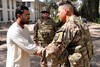 130928-N-RW752-173- Col. Alber Rivera from US Army Reserve Affairs, Afghanistan shakes hands with Director Advisor to the Director of Agriculture, Irrigation and Livestock (DAIL) Frhadi Foroq following a successful Key Leader Engagement to the DAIL compound in Farah City. PRT Farah's Mission is to train, advise and assist Afghan government leaders at the municipal, district and provincial levels in Farah province, Afghanistan.  (U.S. Navy photo by Lt. Chad A. Dulac/ Released)