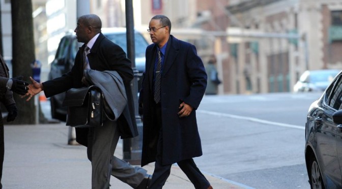 Police van driver Caesar Goodson, right,  enters court in Baltimore.