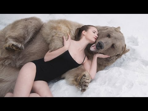 Russian Models Pose Next To Brown Bear