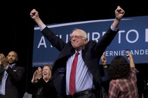 Democratic presidential candidate Sen. Bernie Sanders, I-Vt., center, acknowledges the cheering crowd after a rally Friday, Feb. 19, 2016, in Henderson, Nevada.