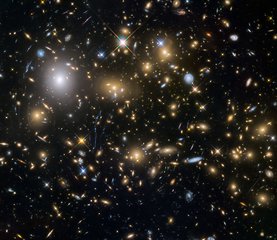 File - Observations by the NASA/ESA Hubble Space Telescope have taken advantage of gravitational lensing to reveal the largest sample of the faintest and earliest known galaxies in the universe. Some of these galaxies formed just 600 million years after the big bang.