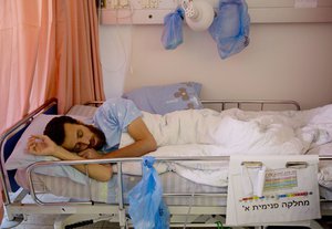 This Wednesday, Feb. 10, 2016. file photo shows hunger striking Palestinian journalist prisoner Mohammed al-Qeq, lying in a hospital bed at the Emek Medical Center in Afula, Al-Qeq family said he ended hunger strike after a record 94 days and that he will be released in three months.