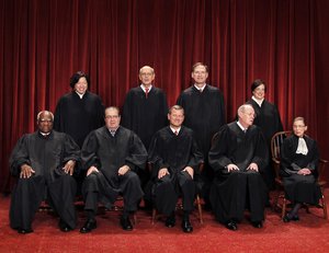 In this Oct. 8, 2010 file photo, the Supreme Court justices pose for a group photo at the Supreme Court in Washington.