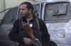 An Afghan security forces member stands guard at the Spanish Embassy which was attacked in Kabul in December.