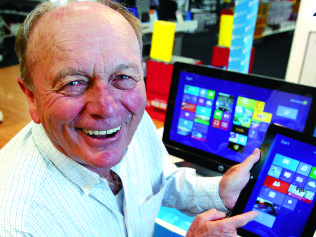 Harvey Norman owner, Gerry Harvey shows off some of the latest products that operate Windows 8, Picture: Brad Hunter