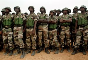 Nigerian soldiers assigned to the 322nd Parachute Regiment line up in formation before participating in target practice facilitated by U.S. Army soldiers during Operation Flintlock 2007.