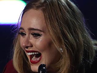 Adele drops a teary F-bomb
