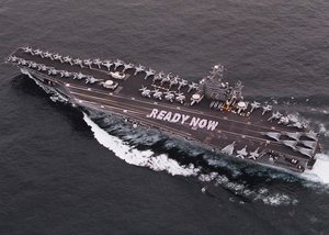 In response to the President's call to "be ready," more than 1,000 Sailors aboard USS Abraham Lincoln show they are ready as the carrier battle group reports for duty for Operation Enduring Freedom on the one-year anniversary of the  Sept. 11, 2001, terrorist attacks on the Pentagon and the World Trade Center.