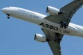 The Airbus A350 flies over Toulouse-Blagnac airport during its maiden flight in southwestern France.