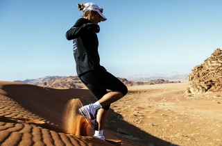 Mina Guli running in the Arabian desert, Jordan.