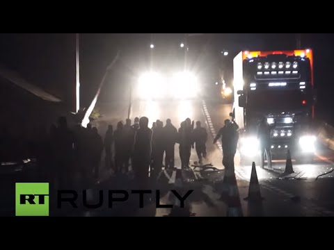 France: Police fire teargas as refugees block trucks over camp eviction