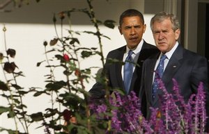 President Bush and President-elect Obama walk along the West Wing Colonnade of the White House in Washington, Monday, Nov. 10, 2008, prior to their meeting at the White House.