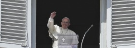 Pope Francis waves to crowds in St Peter's Square. Cardinal Pell says he has the pontiff's backing.