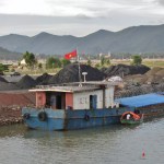 Photo: garycycles/flickr CC-by-2.0  Coal stockpiled at a river wharf, Viet Nam, Nghệ An, Hoàng Mai