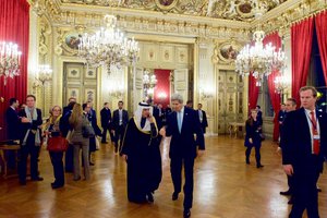 U.S. Secretary of State John Kerry walks with Saudi Arabian Foreign Minister Adel al-Jubeir on December 14, 2015, at the Quai d'Orsay - the French Foreign Ministry - in Paris, France, before a multinational meeting convened by French Foreign Minister Laurent Fabius to discuss the future of Syria.