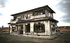 A lone house sits on the scarred landscape, inside the exclusion zone, close to the devastated Fukushima Daiichi Nuclear Power Plant on February 26, 2016 in Namie, Fukushima Japan. The area is now closed to residents due radiation contamination from the Fukishima nuclear disaster. March 11, 2016 marks the fifth anniversary of the magnitude 9.0 earthquake and tsunami which claimed the lives of 15,894, and the subsequent damage to the reactors at TEPCO's Fukushima Daiichi Nuclear Power Plant causing the nuclear disaster which still forces 99,750 people to live as evacuees away from contaminated areas. (Photo by Christopher Furlong/Getty Images)