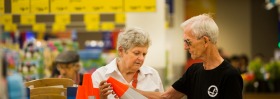 Peter and Mary Ford inspecting witches hats at Aldi. 