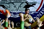 U.S. 5TH FLEET AREA OF RESPONSIBILITY (Feb. 28, 2013) - Denver Broncos quarterback Peyton Manning addresses Sailors of the Nimitz-class aircraft carrier USS John C. Stennis (CVN 74) during a USO sponsored visit led by Vice Chairman of the Joint Chiefs of Staff Adm. James Winifield. John C.