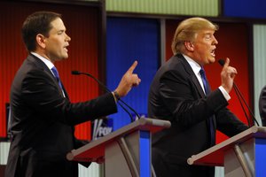 Republican presidential candidates, Sen. Marco Rubio, R-Fla., and businessman Donald Trump argue during a Republican presidential primary debate at Fox Theatre, Thursday, March 3, 2016, in Detroit.