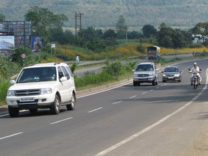 A private car moves along the highway, India