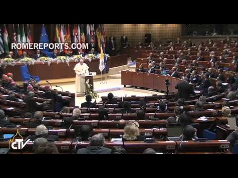 Pope Francis greets disabled youth while leaving the Council of Europe