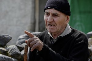 In this April 8, 2015 photo, Temur Batirashvili, the father of Tarkhan Batirashvili, aka Omar al Shishani, speaks to The Associated Press at his house in the village of Duisi, about 70 km (43 miles) north of Tbilisi, in the Pankisi Gorge, Georgia.