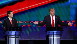 Republican presidential candidate, businessman Donald Trump, right, answers a question, as Republican presidential candidate, Sen. Marco Rubio, R-Fla., listens, during the Republican presidential debate sponsored by CNN, Salem Media Group and the Washington Times at the University of Miami, Thursday, March 10, 2016, in Coral Gables, Fla.