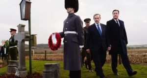 Enda Kenny and David Cameron visiting the grave of Irish MP Willie Redmond in Heuvelland in Belgium in 2013. Photograph: Stefan Rousseau/PA 